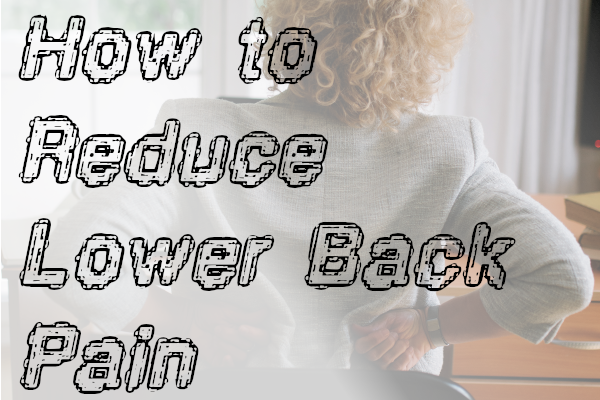 White businesswoman nursing lower back pain