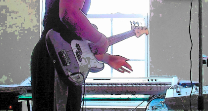 Jacqueem Jt Spratley playing bass guitar